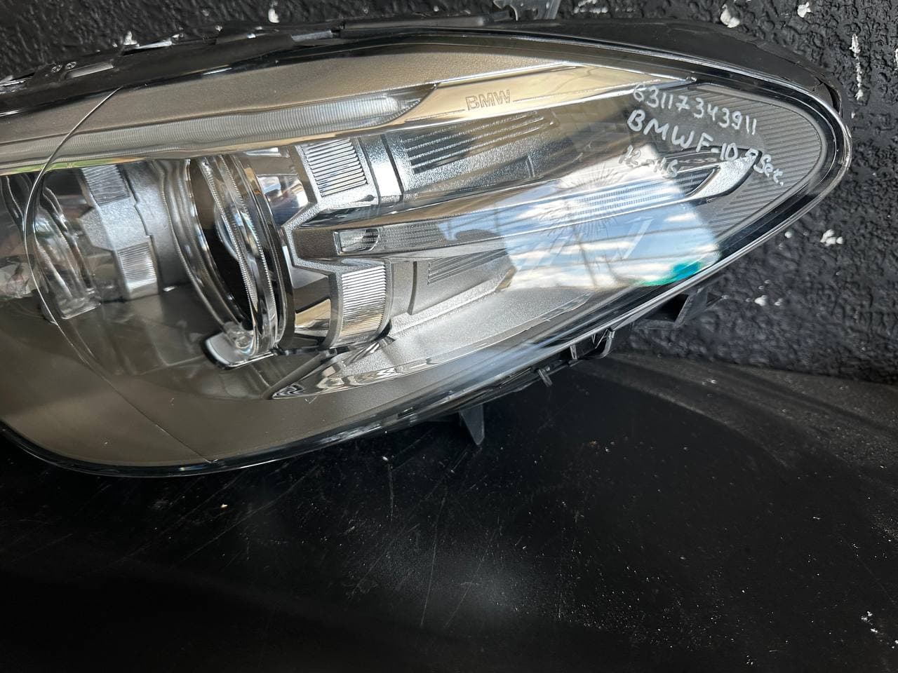 Фара BMW X1 09-12 б/у OEM 63112990007